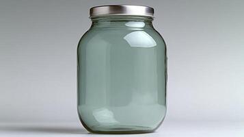 A transparent jar sits alone, reflecting soft light and emphasizing its minimalist beauty photo