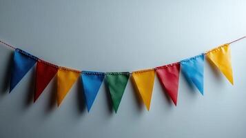 Brightly colored triangular flags hang in a cheerful display, enhancing the festive ambiance photo
