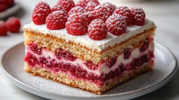 A delectable cake with layers of cream and raspberries, topped with fresh berries for a sweet treat photo