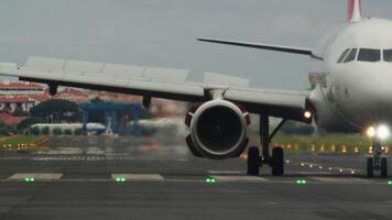 Airplane taxiing on the runway after landing, showcasing the busy atmosphere of an airport and air travel operations video