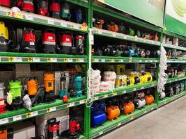 Kyiv, Ukraine - January 03, 2025 Selection of water pumps and equipment displayed on store shelves photo
