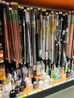 Kyiv, Ukraine - January 03, 2025 Variety of home cleaning tools and household products in a store display photo