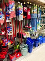 Kyiv, Ukraine - January 03, 2025 Assorted Cleaning Tools and Buckets Displayed in a Retail Store photo