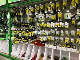 Kyiv, Ukraine - January 03, 2025 Selection of gardening tools and accessories on display in a hardware store photo