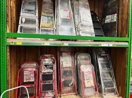 Kyiv, Ukraine - January 03, 2025 Shelf Display of Ladders in a Hardware Store photo