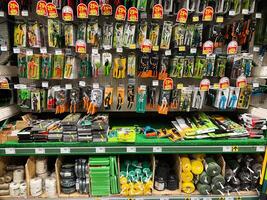 Kyiv, Ukraine - January 03, 2025 Various handheld garden tools on display in a well-organized store aisle photo