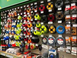 Kyiv, Ukraine - January 03, 2025 Wall Display of Various Hardware and Accessories in Hardware Store photo