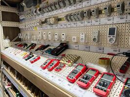 Kyiv, Ukraine - January 03, 2025 Display of electronic measurement tools and devices in a retail hardware store photo