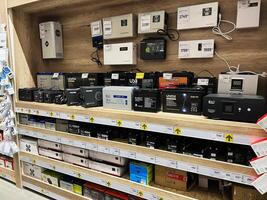 Kyiv, Ukraine - January 03, 2025 Display of backup batteries and power storage units on retail store shelves photo