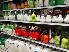 Kyiv, Ukraine - January 03, 2025 Shelves filled with plastic spray bottles and jugs of various colors photo
