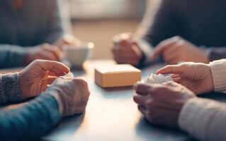 group of people engaged in therapy session, hands reaching out for support and connection photo