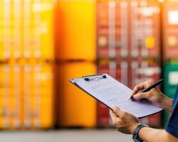Efficient freight management with clipboard in warehouse setting photo