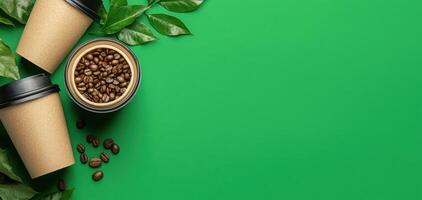 Eco friendly coffee packaging with beans and leaves on green background photo