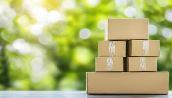 Neatly stacked shipping boxes on table with blurred green background photo