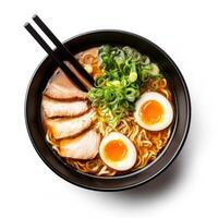 Delicious bowl of ramen with tender pork, soft boiled eggs, and green onions photo