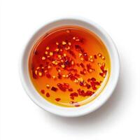 vibrant bowl of hot chili oil with red pepper flakes, perfect for adding flavor photo
