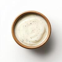 Creamy ranch dressing in wooden bowl, smooth texture, flavorful seasoning. Perfect for dipping or salads photo