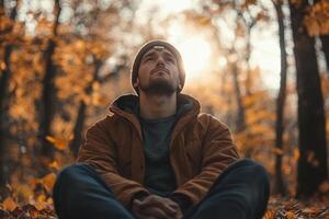 Thoughtful Man Sitting in the Serene Woods Reflecting on Nature's Beauty photo