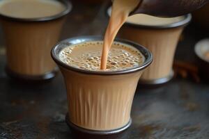 Traditional Masala Chai Tea Poured into a Cup for a Cozy Beverage Experience photo