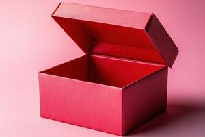 Red Gift Box with Open Lid on Pink Background Ideal for Holiday and Celebration Themes photo