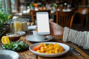 Woman Holding a Smartphone with a Blank Screen for App Customization and Design Use photo