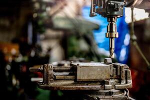 In metalworking a lathe grinder operates efficiently to finish the steel surface with precision. photo