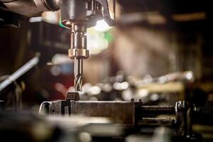 The smooth operation of a lathe grinder machine is displayed as it refines the steel column surface. photo
