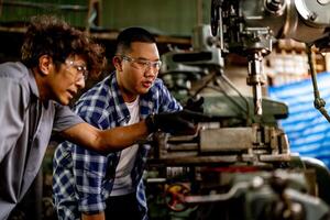 The lathe grinder machine operates efficiently producing sparks as it finishes the internal steel surface. photo