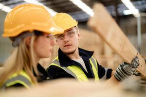 Engineers ensure the condition of timber materials during a warehouse walkthrough. photo