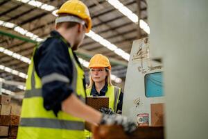 Engineers evaluate timber products during a walkthrough of the manufacturing warehouse. photo