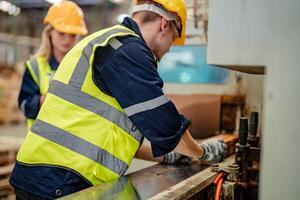 Engineers assess timber materials in a warehouse for suitability in production processes. photo