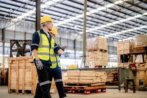Engineers review timber products for quality during a routine inspection of the warehouse. photo