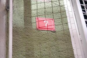 A Mysterious Red Marker Appears on the Wall, Captivating Attention and Curiosity photo