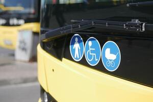 Enhancing accessibility with yellow checkerboard symbols for public transportation icon display photo