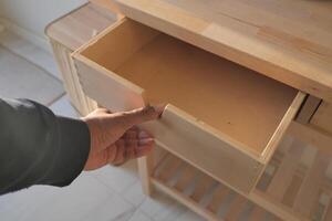 top view of men hand open a a drawer photo