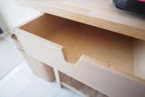 An Empty Wooden Drawer Showcasing an Elegant Minimalist Design Style photo