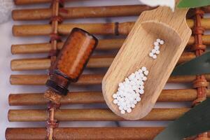 Homeopathic pills containers on a table photo