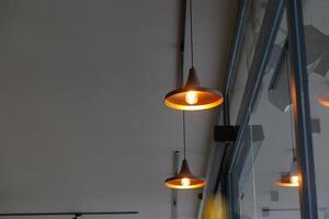 Elegant and Stylish Pendant Lights Beautifully Hanging from a Modern Ceiling photo