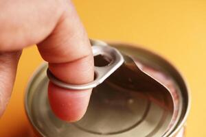 Using the Pull Tab Mechanism to Open a Beverage Can with Ease and Safety photo