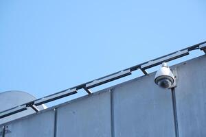 Security Camera Successfully Mounted on the Wall for Optimal Surveillance Purpose and Use photo