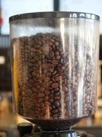 Intimate CloseUp of Coffee Beans Situated Within Grinding Container photo