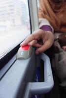 Closeup of Bus bell switch for stop inside the public bus photo