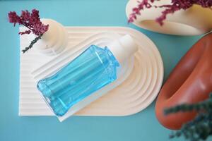 mouthwash liquid in a container on table photo
