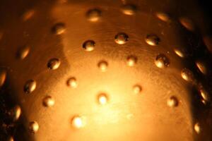 Abstract background of illuminated yellow bubbles. photo