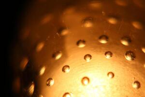 Abstract background of illuminated yellow bubbles photo