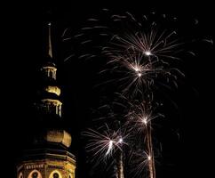 Cathedral of Greifswald, Mecklenburg-Vorpommern, Germany - Dom St. Nikolai - at night illuminated by fireworks. photo