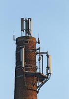 Close up of old chimney used as a base for radio transmitters. photo