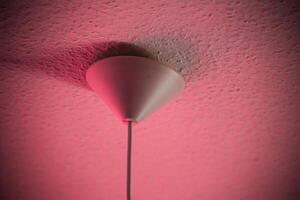 Conceptual shot of lamp part at the ceiling. photo