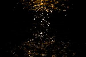 Red light effect on water in hourglass shape. photo