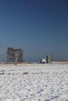 Pumping station in a winter landscape on the Karrendorfer Wiesen near Greifswald, Mecklenburg-Vorpommern, Germany photo